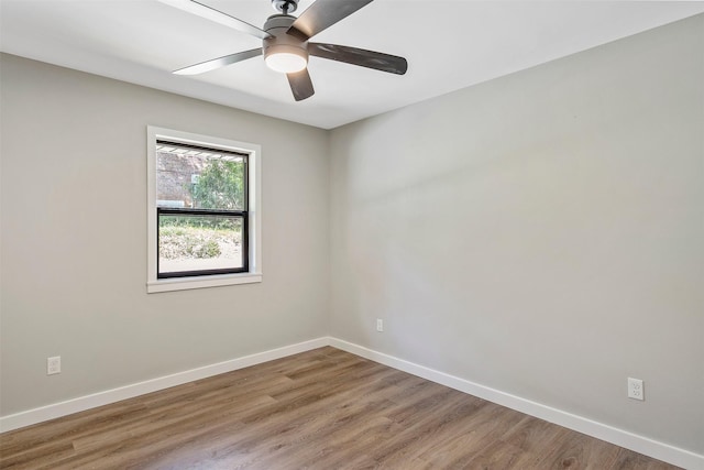 unfurnished room with ceiling fan and hardwood / wood-style floors