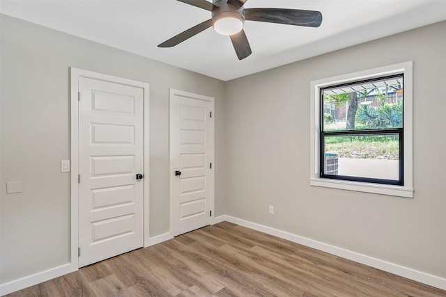 empty room featuring ceiling fan and light hardwood / wood-style floors