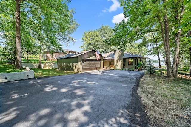 ranch-style house featuring a garage