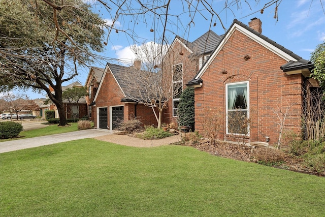 view of front of house with a garage and a front yard