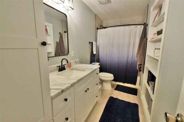 full bathroom with vanity, toilet, and shower / bath combo with shower curtain