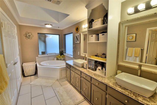 bathroom featuring tile patterned floors, a tub to relax in, crown molding, vanity, and a tray ceiling