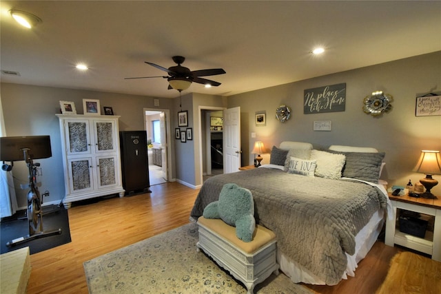 bedroom with hardwood / wood-style flooring and ceiling fan