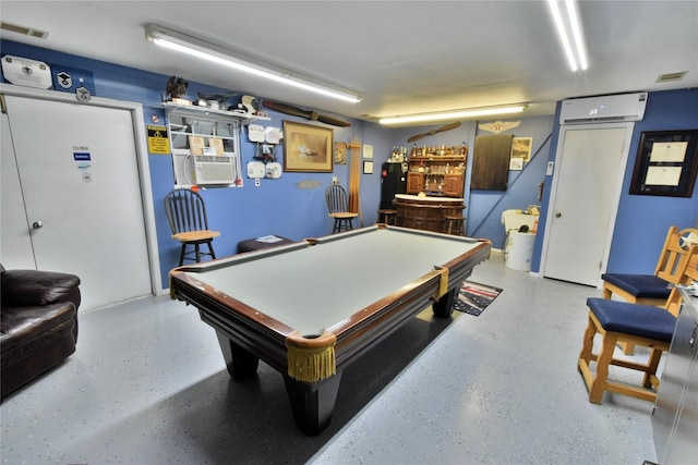 recreation room with bar, cooling unit, a wall unit AC, and billiards