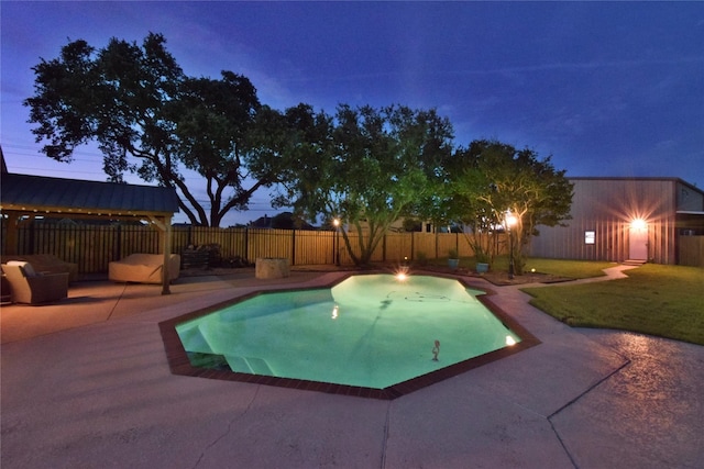 pool at dusk featuring a yard and a patio area