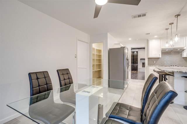 dining space with ceiling fan