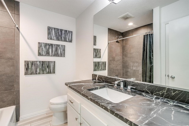 bathroom featuring vanity, wood-type flooring, and toilet