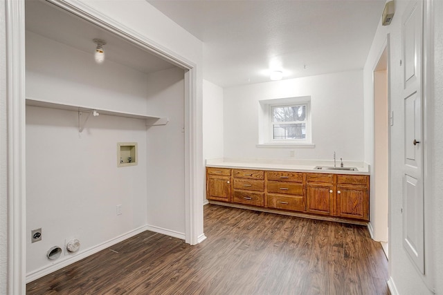 laundry area with hookup for an electric dryer, sink, washer hookup, and dark hardwood / wood-style flooring