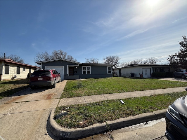 view of front of property with a garage, a front yard, and concrete driveway