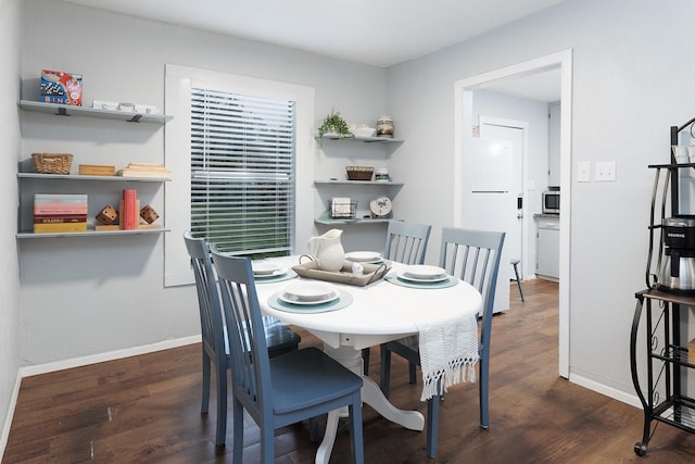 dining area with dark wood-type flooring