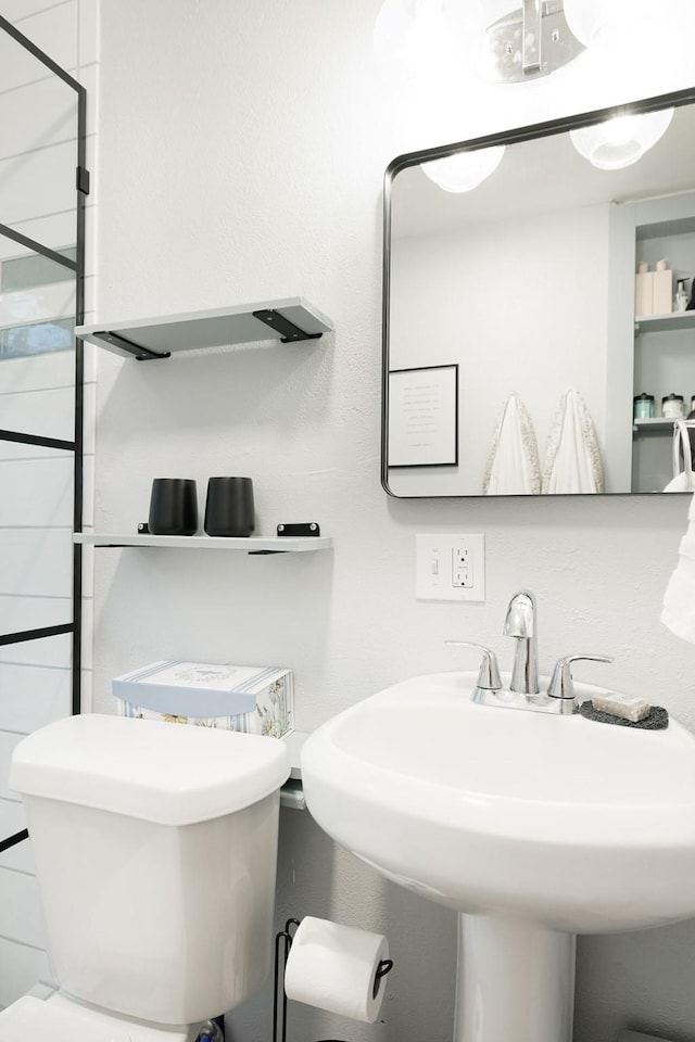 bathroom with sink and toilet