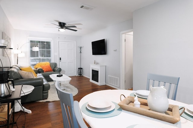 dining room featuring ceiling fan and dark hardwood / wood-style floors