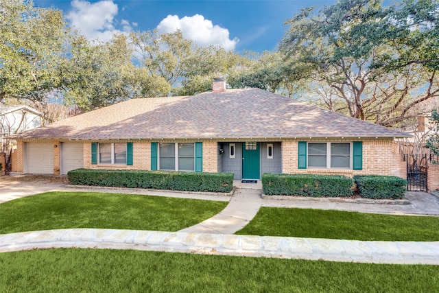 single story home featuring a garage and a front yard