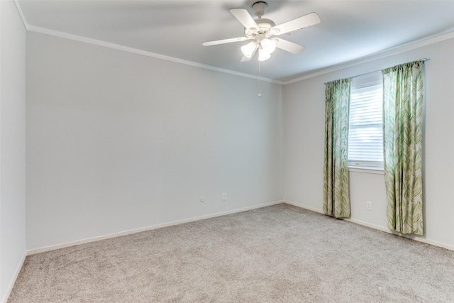 unfurnished room with ornamental molding and light carpet