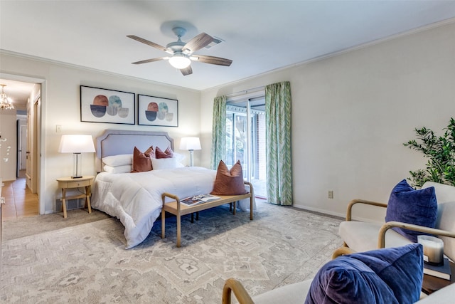 bedroom with light colored carpet, ornamental molding, and ceiling fan with notable chandelier