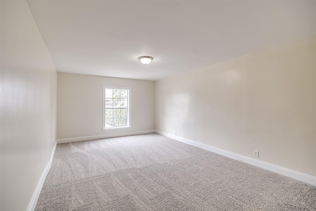 unfurnished room with carpet floors