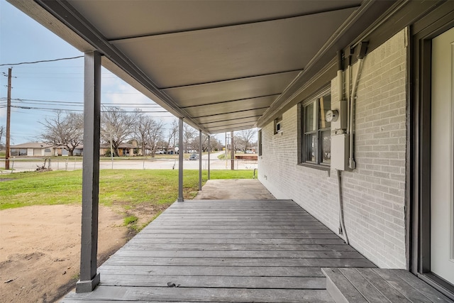 wooden deck featuring a yard