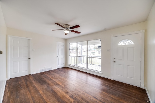 foyer entrance featuring dark wood-type flooring and ceiling fan