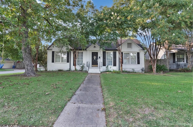 ranch-style house featuring a front lawn