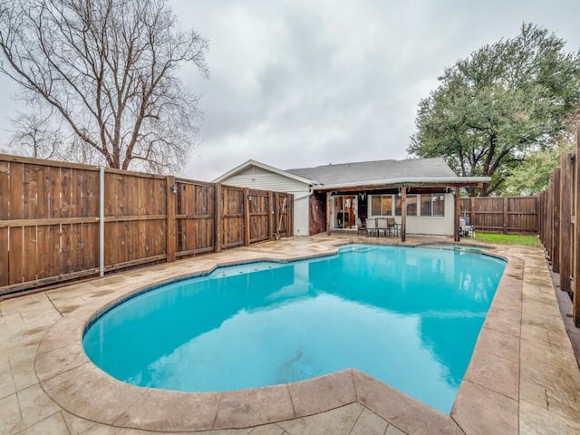 view of swimming pool featuring a patio area