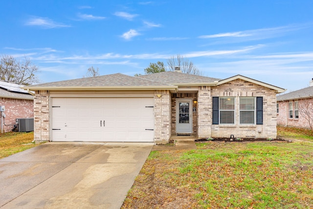 ranch-style home with a garage, central AC, and a front lawn