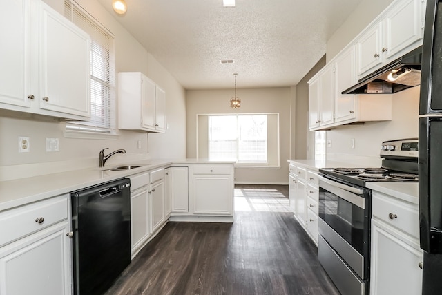 kitchen with pendant lighting, sink, dishwasher, stainless steel range with electric stovetop, and white cabinetry