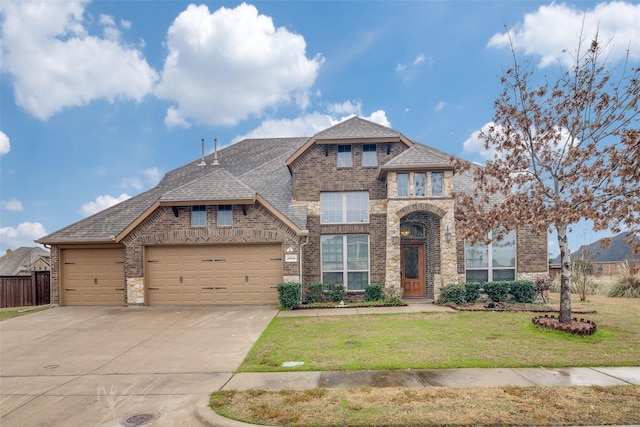 view of front of house featuring an attached garage, brick siding, concrete driveway, roof with shingles, and a front lawn