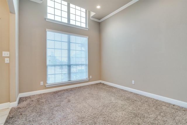 carpeted empty room featuring ornamental molding