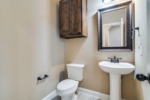 bathroom with sink, tile patterned floors, and toilet