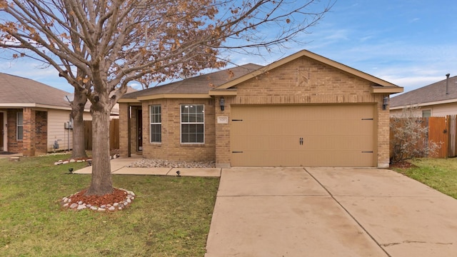 single story home with a garage and a front lawn