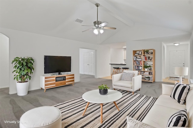 living room featuring light colored carpet, ceiling fan, and lofted ceiling with beams