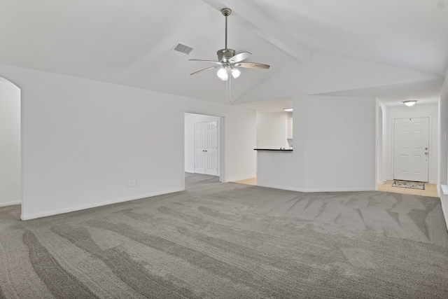 unfurnished living room featuring vaulted ceiling with beams, light carpet, and ceiling fan