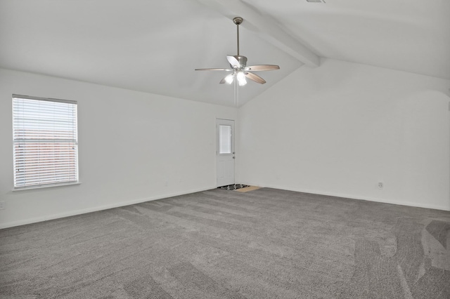 unfurnished room with vaulted ceiling with beams, ceiling fan, and carpet