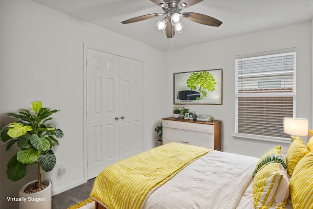 bedroom featuring ceiling fan, carpet, and a closet