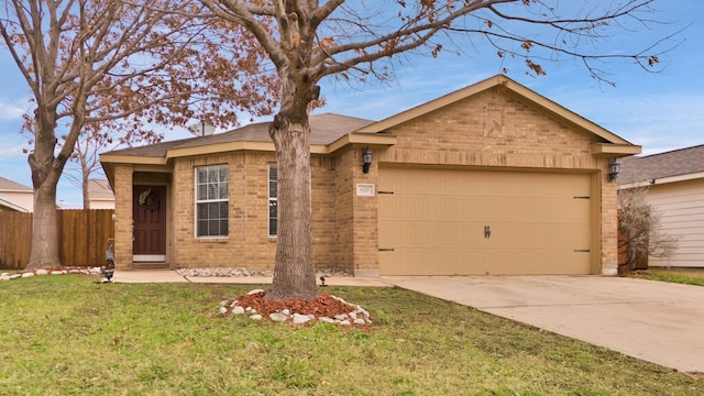 ranch-style home featuring a garage and a front yard