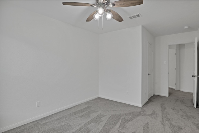 carpeted empty room with ceiling fan