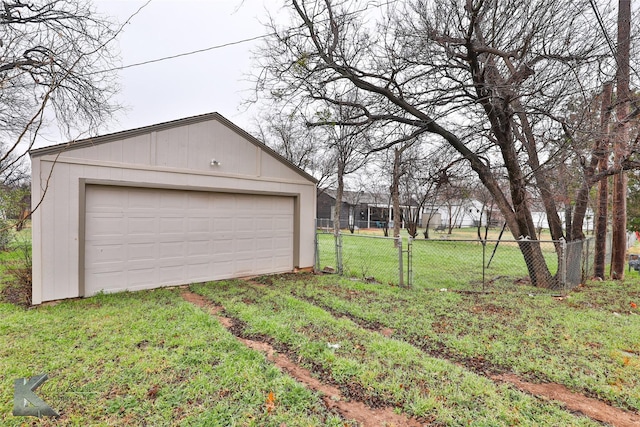 garage featuring a lawn