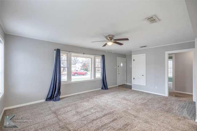 spare room featuring carpet flooring and ceiling fan