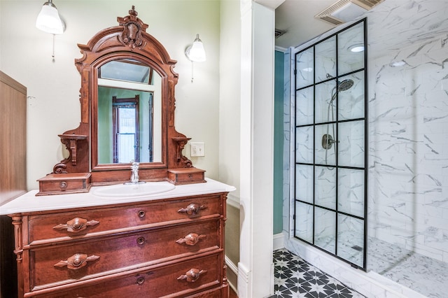 bathroom featuring vanity and a tile shower