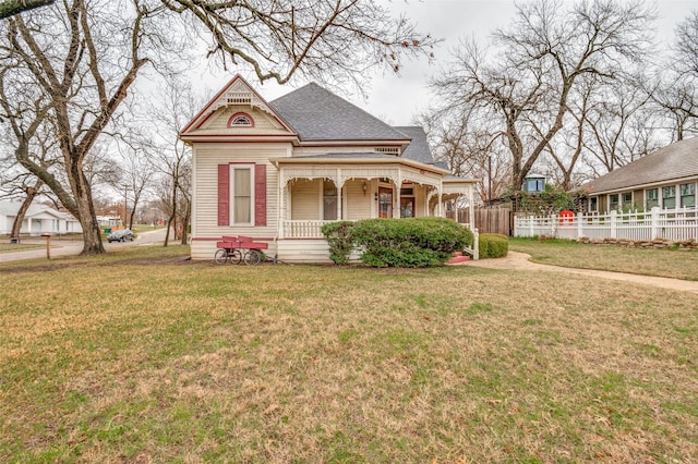 view of front of property with a porch and a front yard