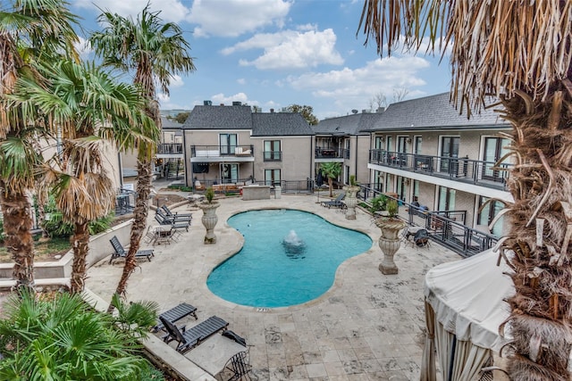 view of swimming pool with a patio area