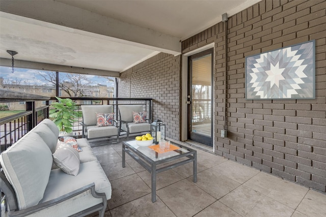 interior space featuring outdoor lounge area and a balcony