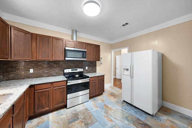 315 Park St, Commerce, TX 75428 - kitchen with appliances with stainless steel finishes, baseboards, stone tile floors, decorative backsplash, and crown molding