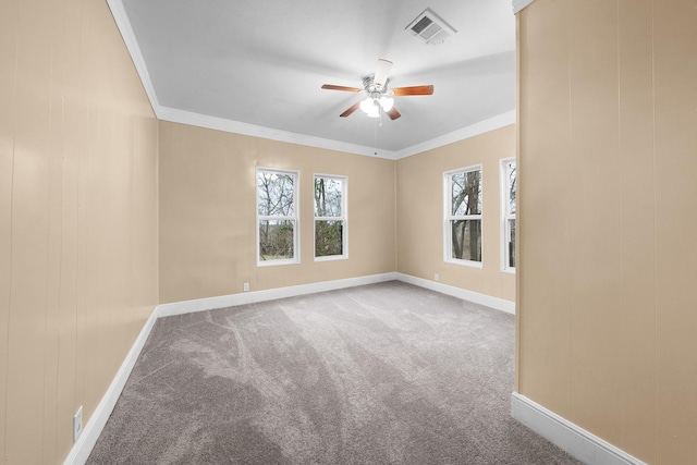 315 Park St, Commerce, TX 75428 - carpeted empty room featuring a ceiling fan, baseboards, and ornamental molding