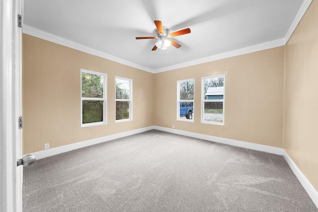 315 Park St, Commerce, TX 75428 - carpeted spare room with ceiling fan, crown molding, and baseboards