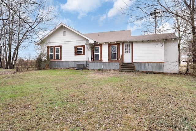 315 Park St, Commerce, TX 75428 - view of front facade featuring entry steps, a front yard, central AC unit, and roof with shingles