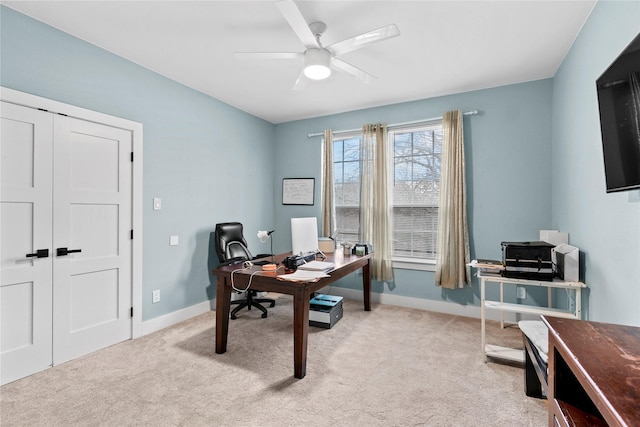 carpeted office with ceiling fan