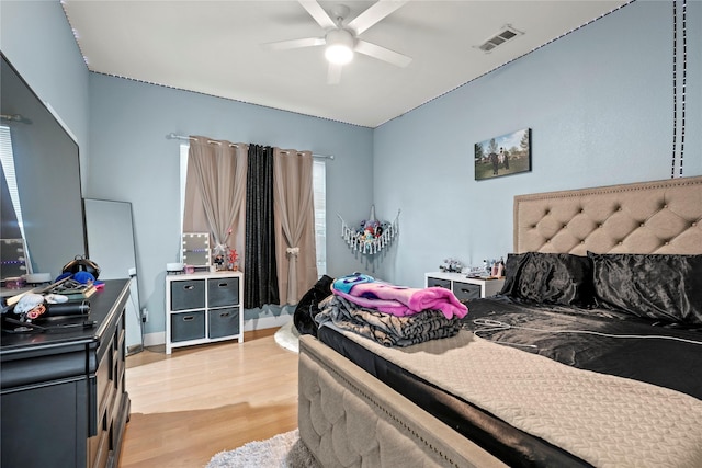 bedroom featuring ceiling fan and light hardwood / wood-style flooring