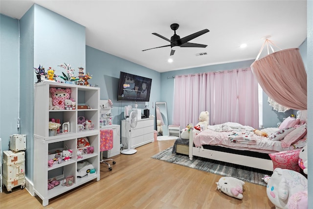 bedroom featuring hardwood / wood-style flooring and ceiling fan