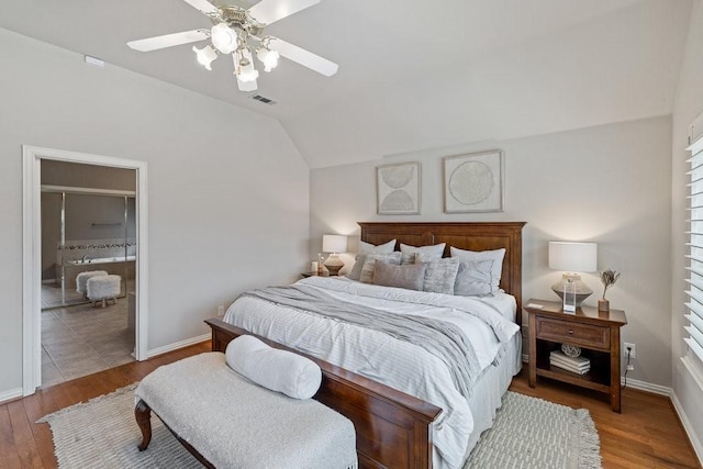 bedroom featuring hardwood / wood-style flooring, lofted ceiling, and ceiling fan